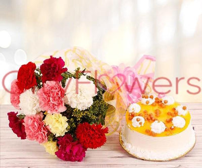ASSORTED CARNATIONS WITH BUTTERSCOTCH CAKE flowers CityFlowersIndia 